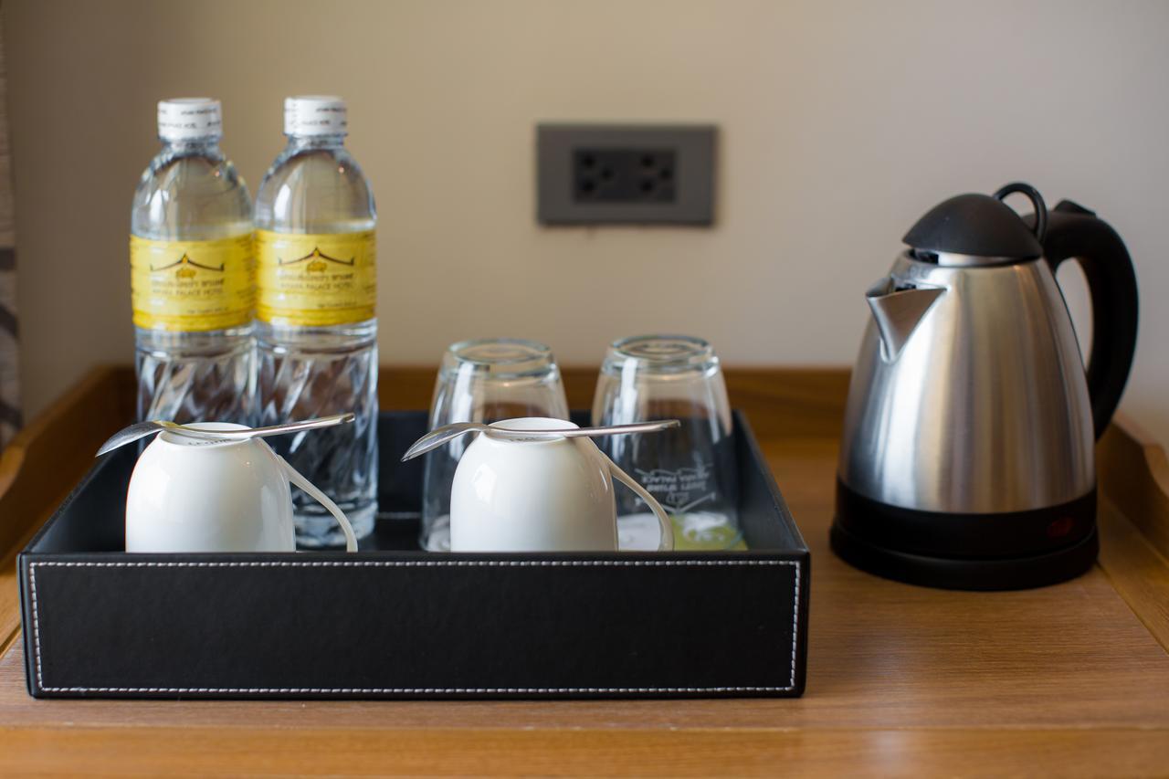 Aiyara Palace Pattaya Exterior photo Bottled water and a kettle in a hotel room